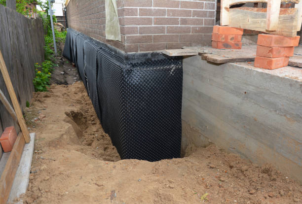 Happy homeowners after waterproofing job in Albion